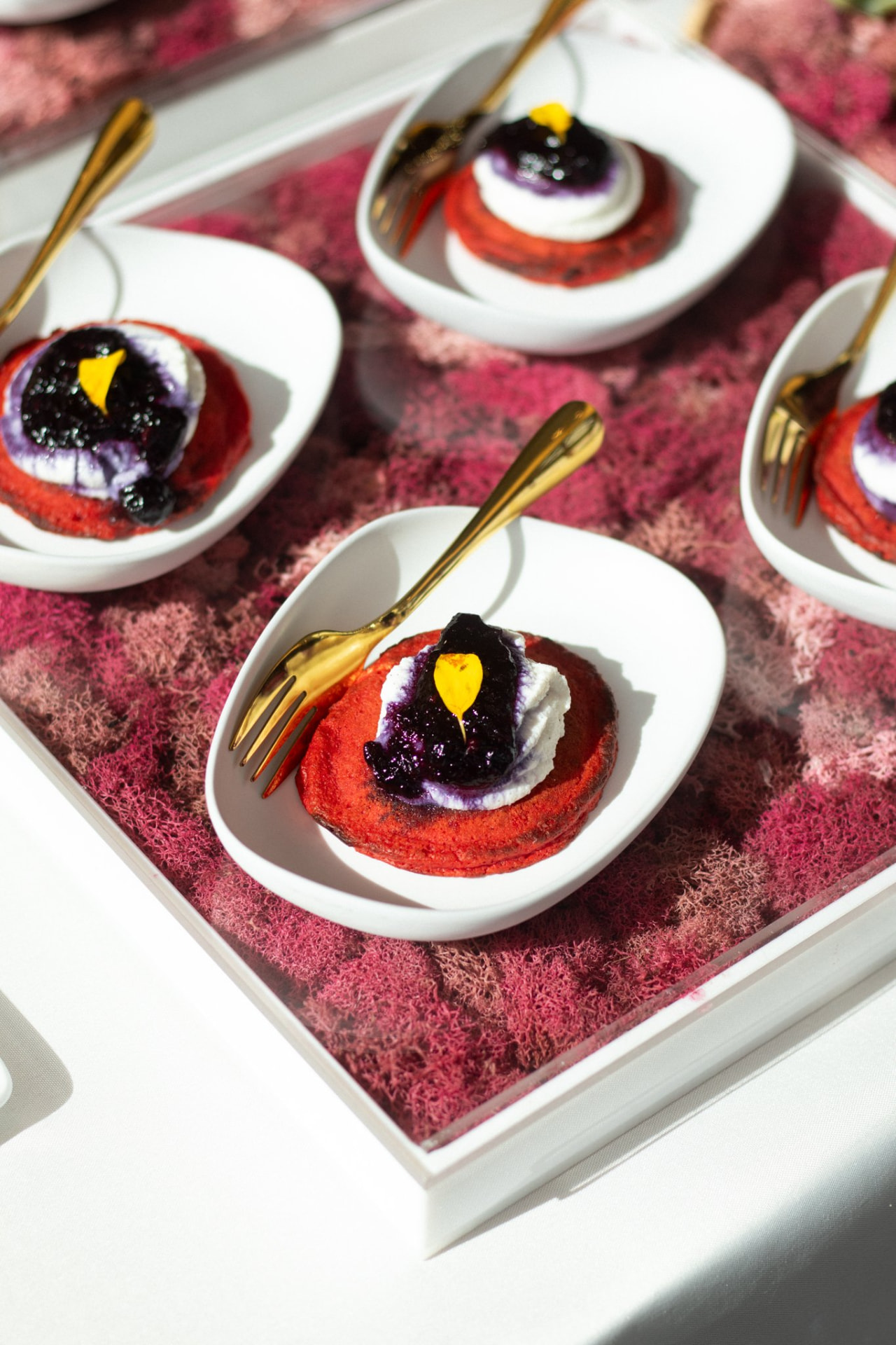Plated brunch detail on a moss tray